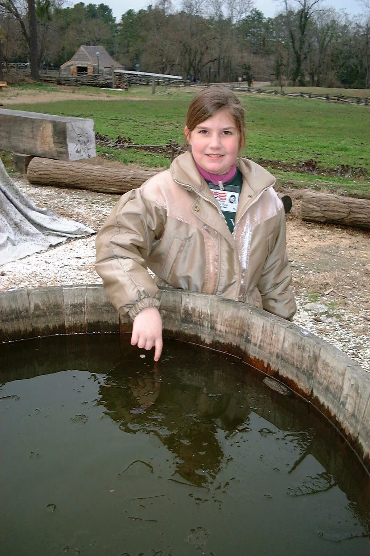 Danielle standing behind a barrel of ice at Colonial Williamsburg