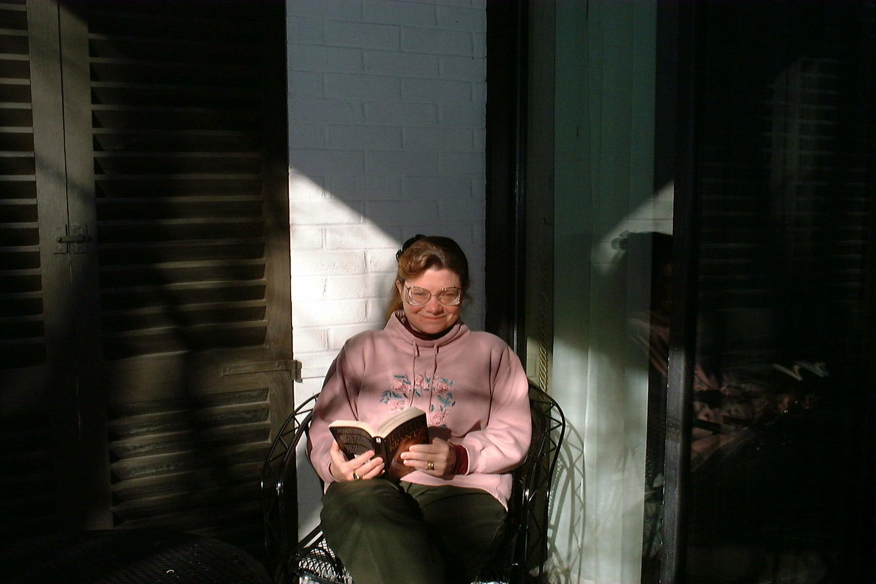 Linda relaxing on the porch at Kingsmill