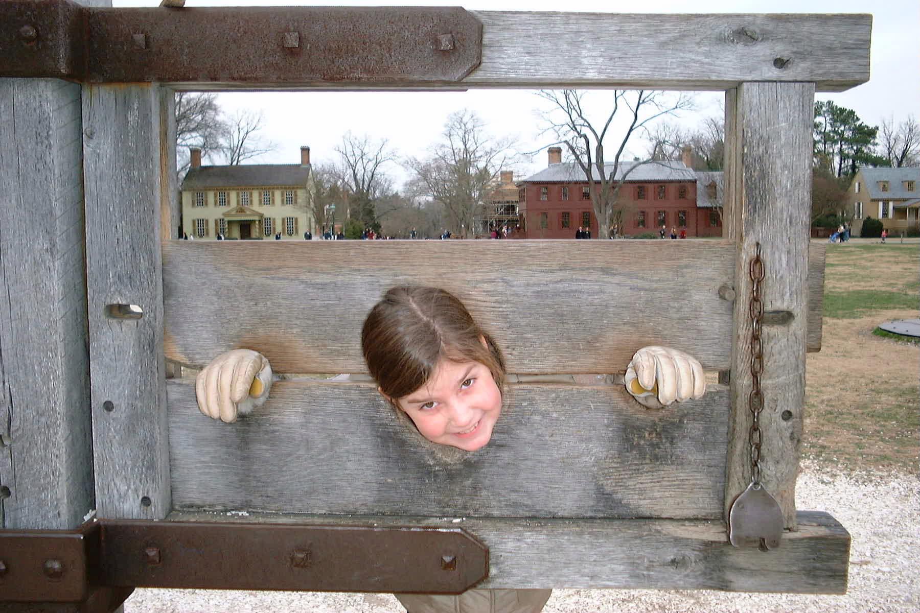 Danielle in the stocks at Colonial Williamsburg
